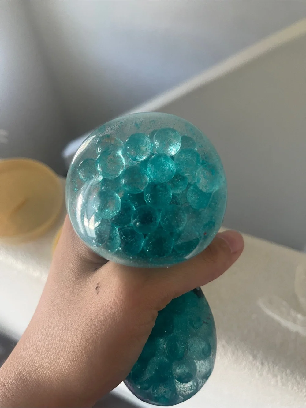 Kids Teal Jelly Bath Slime in Beige Storage Tin - Cute Face